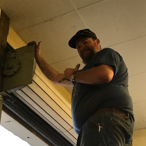 Martin Garage Door Technician Servicing Commercial Door