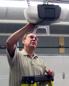 Martin Garage Door Technician Installing an Opener.